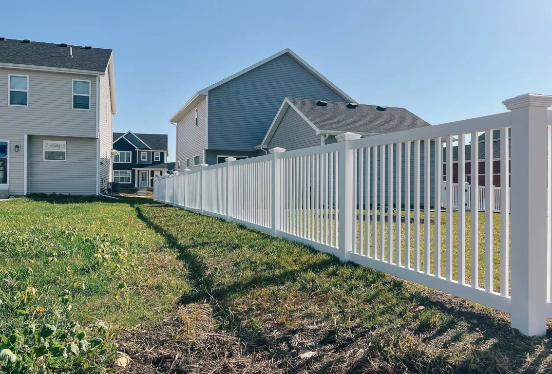 White vinyl picket fence in Yuma residential neighborhood